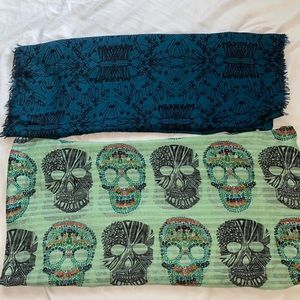 Two scarfs one safety pin patterned one skull